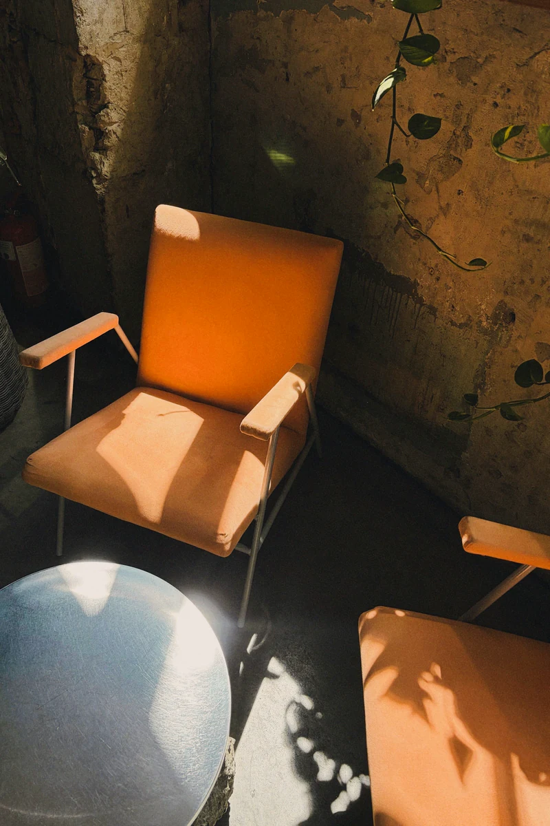 Illustrative reference: Terracotta chairs and strong sunlight used as a composition and color-study reference